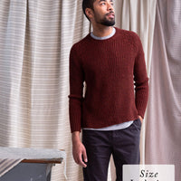 Fehling Sweater | Knitting Pattern by Emily Greene modeled by Anthony in Imbue color Cloak