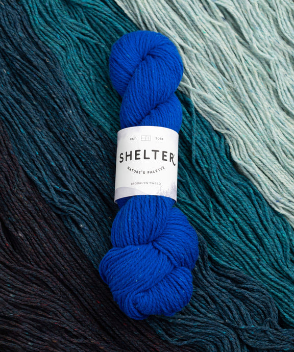 Shelter Yarn | 100% USA-Grown Targhee-Columbia Wool | Cover Image featuring yarn waves and Shelter Cadet